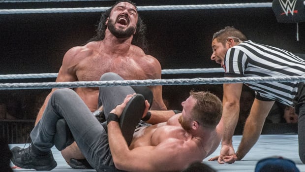 Dean Ambrose puts Drew McIntyre in a leg lock at Garret Coliseum in Montgomery on the Road to Wrestlemania in 2019.